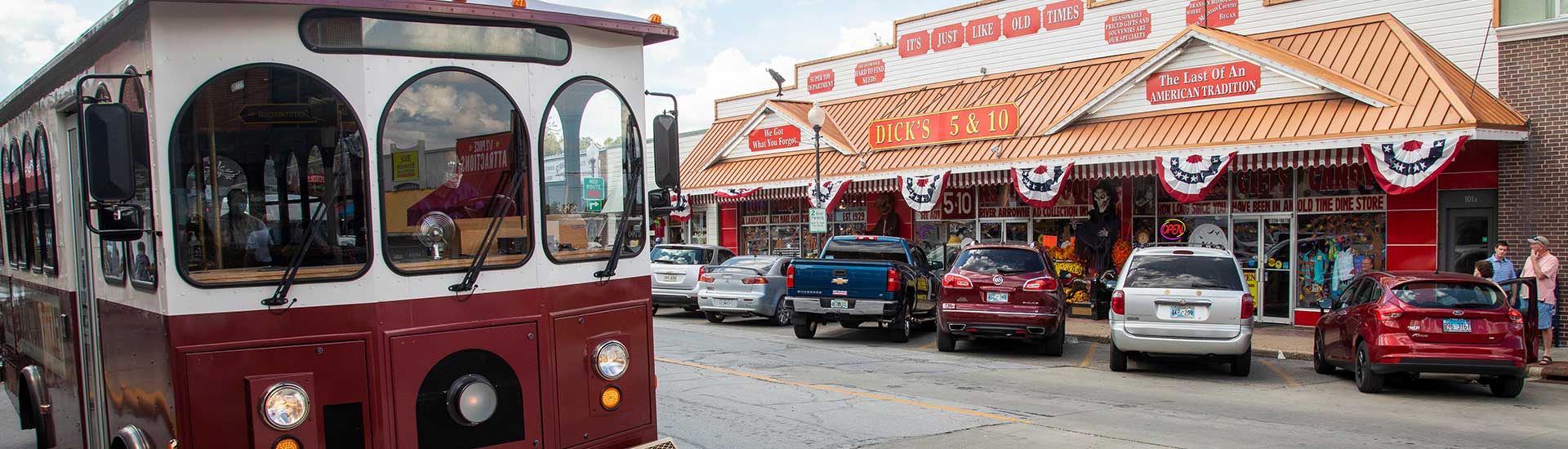 Sparky, the free Downtown Branson Trolley parked across from Dick's 5&10 on Main Street, Branson, MO.
