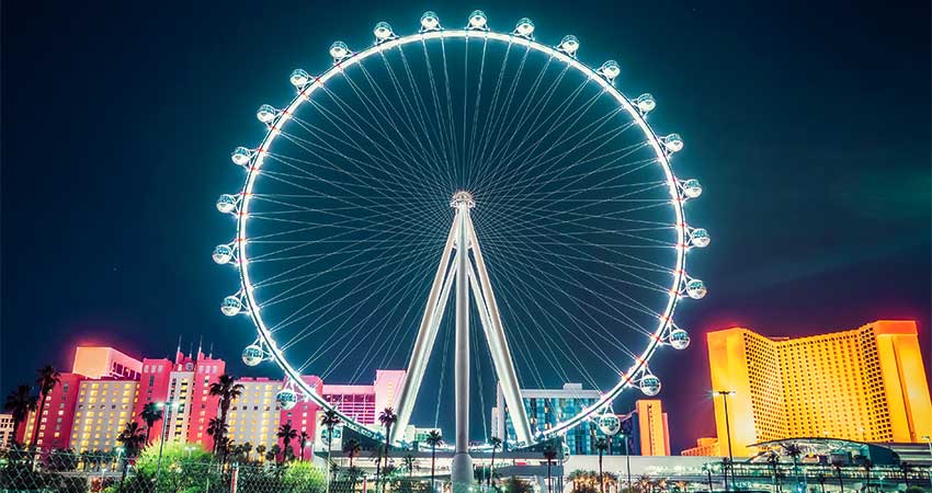 The Las Vegas High Roller glows in neon lights after dark and towers  550-feet above the Las Vegas Strip.