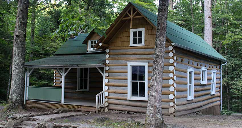 Restored log cabin in the forest near the Elkmont Historic District in the Great Smoky Mountains, Tennessee.