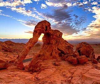 Valley Fire Elephant Rock 325X275 Crimson Aztec sandstone view of Elephant Rock against blue-violet sunset, Valley of Fire State Park near Las Vegas, NV.