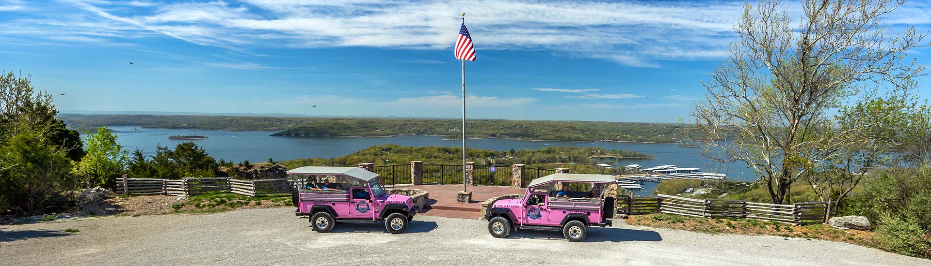 Two Pink Jeep Wranglers parked at the flagpole atop Baird Mountain, overlooking Table Rock Lake, Branson, MO.