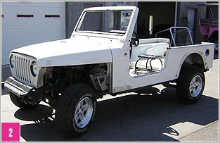 New Pink® Jeep® Wrangler disassembled with white primer, ready for canopy and seat installation.