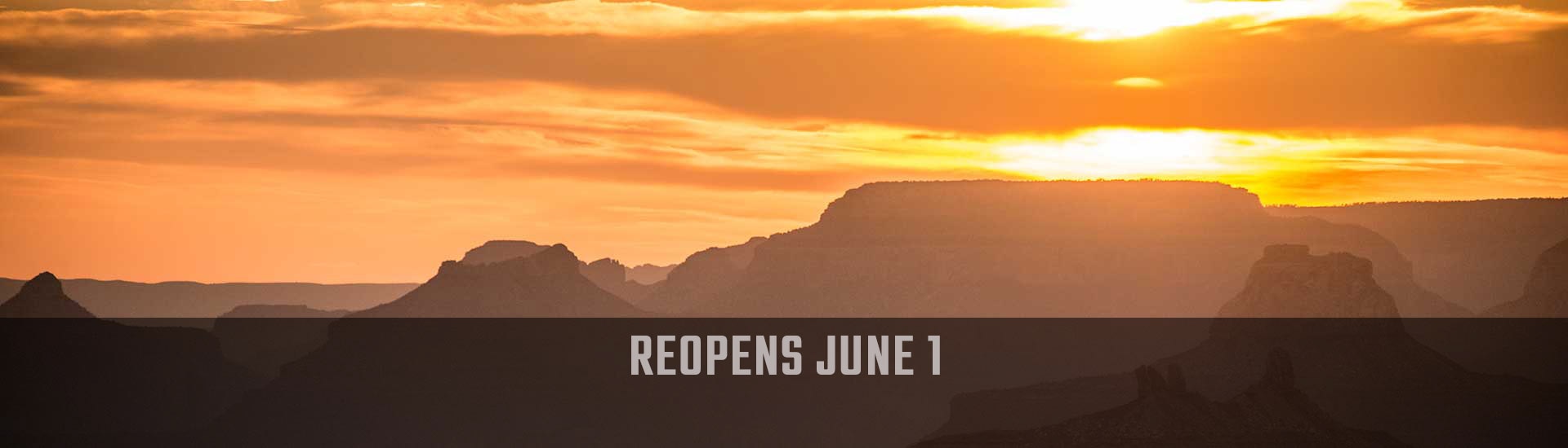 Golden sun sets behind the jagged South Rim of the Grand Canyon, Hermits Rest Hike & Jeep Sunset Tour reopens June 1 banner.